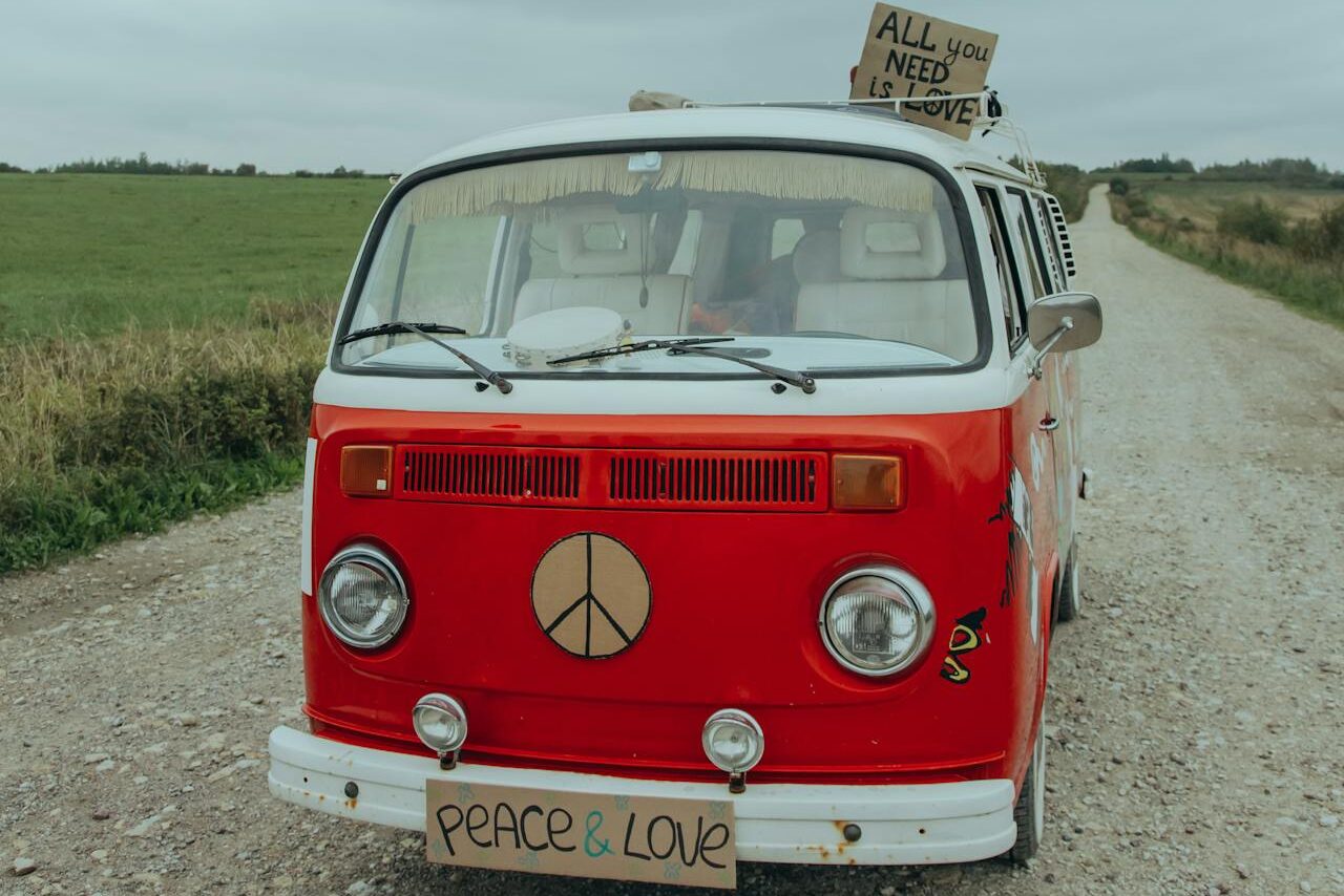 classic red vw van with peace symbol